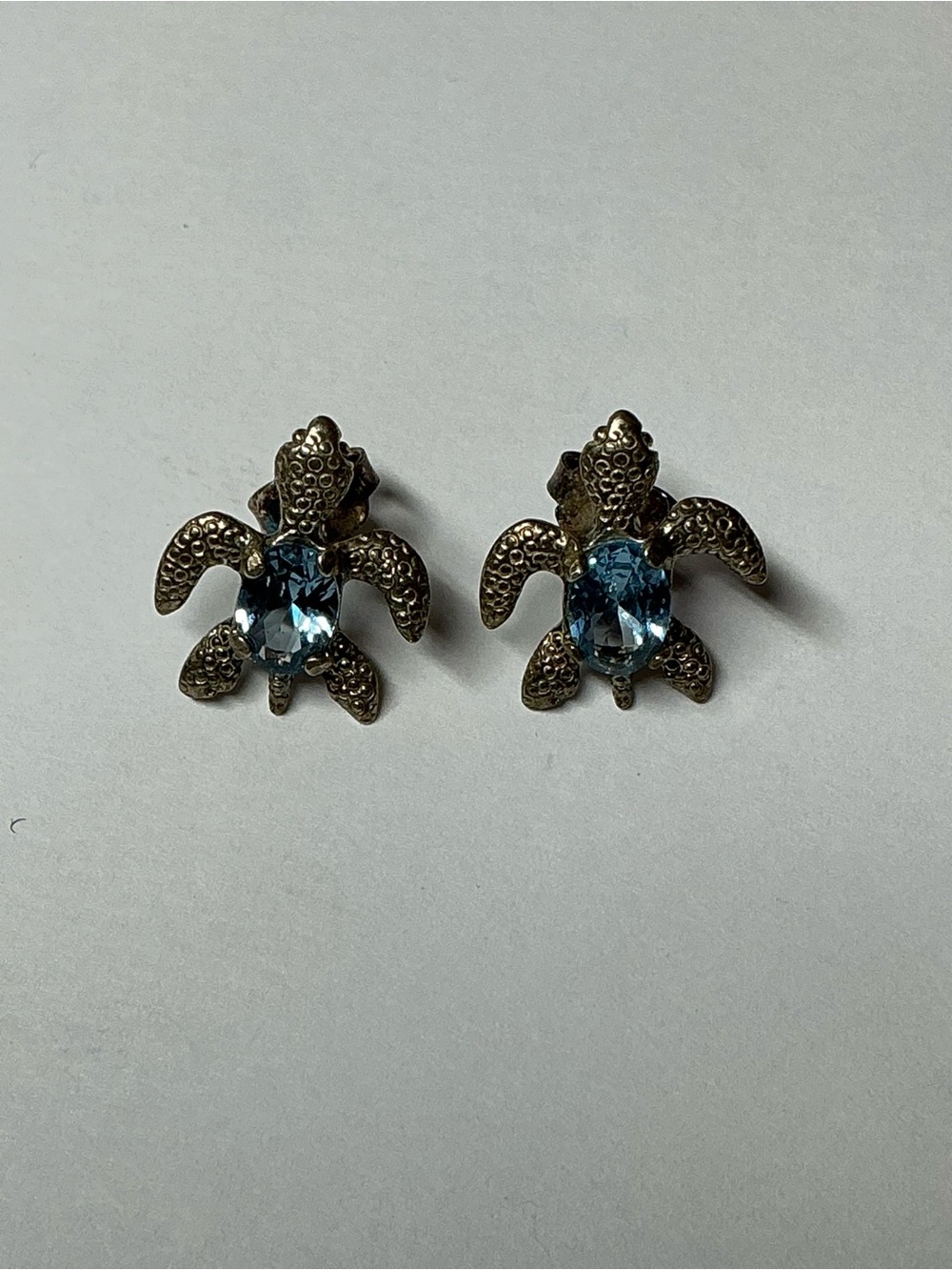 950 Silver Sea Turtle Stud Earrings with a Blue Stone